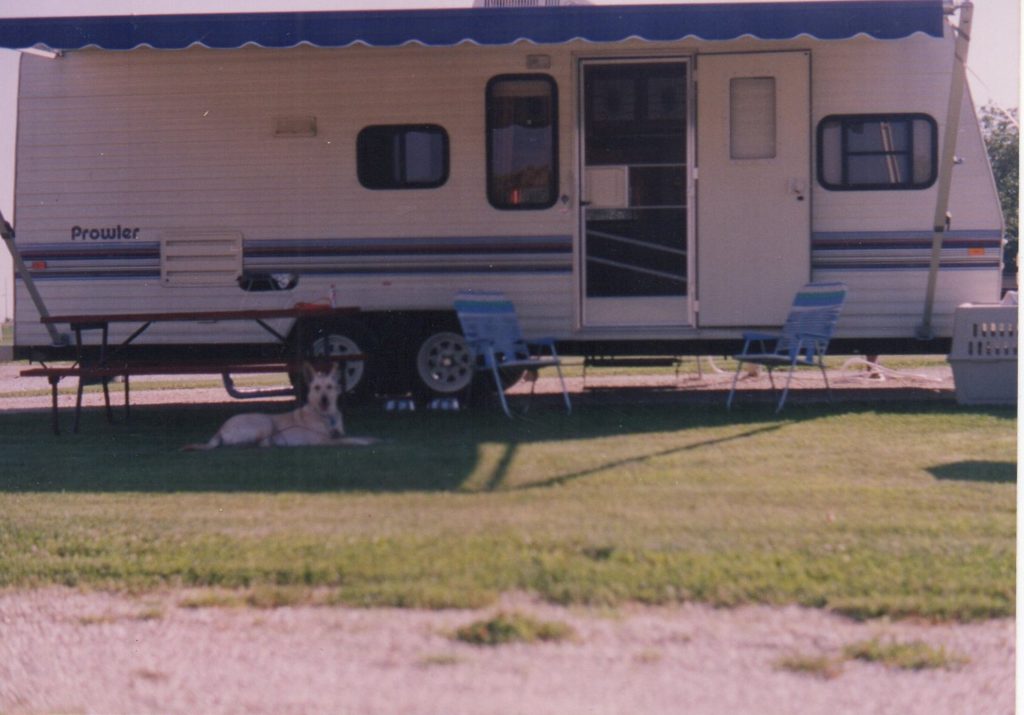 Our First Dog, Shana, hanging out in front of the Prowler.